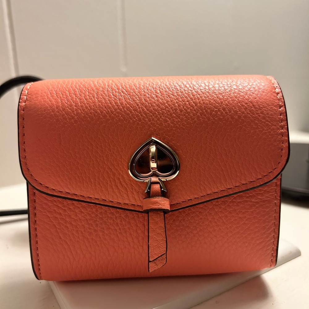 Kate Spade pink wallet with gold accents